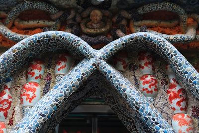 Low angle view of cross on roof of building