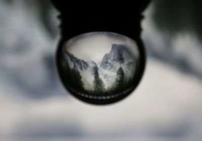 Close-up of crystal ball on glass