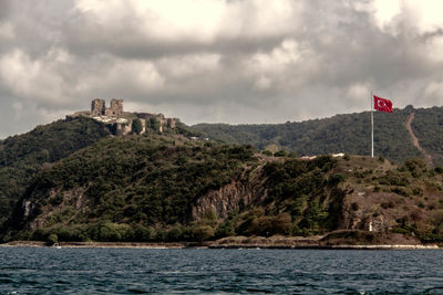 Scenic view of old ruin against cloudy sky