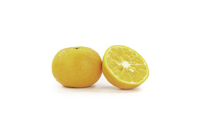 Close-up of fruits against white background