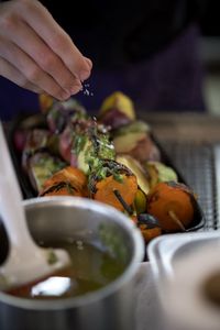 Close-up of person in plate on table