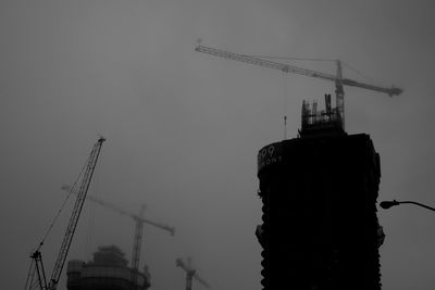 Low angle view of crane at construction site