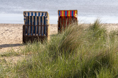 Hooded chairs on beach