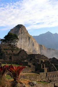 Scenic view of mountain against cloudy sky