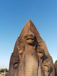 Low angle view of statue against sky