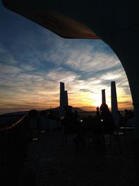 Scenic view of city against sky during sunset