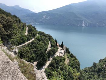 High angle view of trees and buildings against mountains