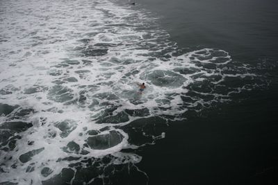 High angle view of man swimming in sea 