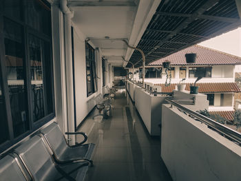 Empty chairs and tables in building