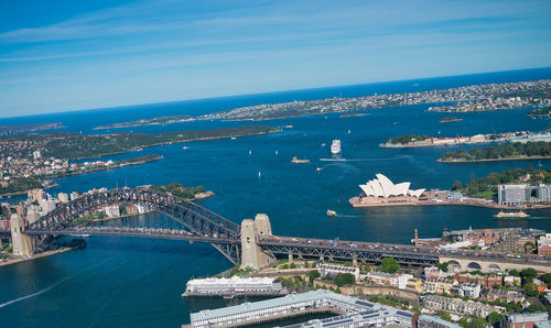 High angle view of bridge over sea against buildings in city