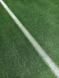High angle view of white single line on soccer field