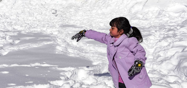 Full length of woman in snow