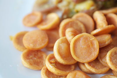 Close-up of fresh dried apricots pile on table