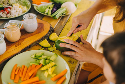 Midsection of woman preparing food