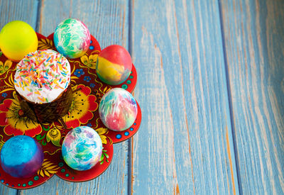 High angle view of multi colored eggs on table