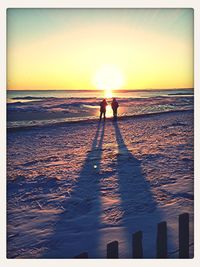 Silhouette of people at sunset