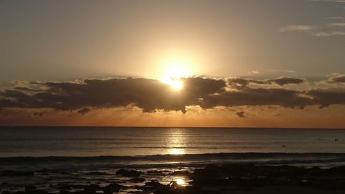 Scenic view of sea against sky at sunset