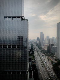 Modern buildings in city against sky