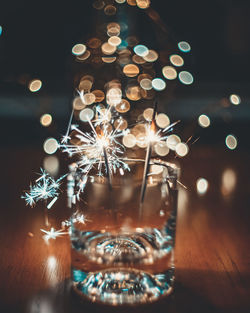 Close-up of illuminated sparklers at night