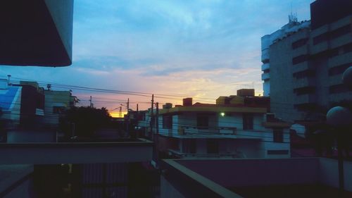 View of buildings against sky at sunset