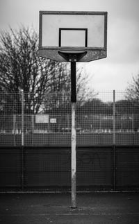 Close-up of basketball hoop against sky