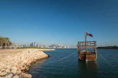 Scenic view of sea against clear blue sky, doha, qatar 