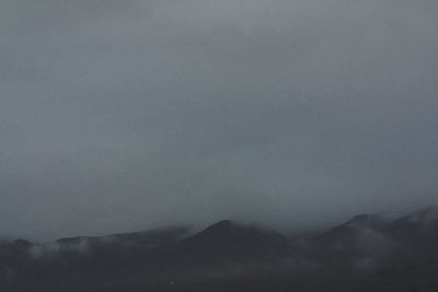 Scenic view of silhouette mountain against sky