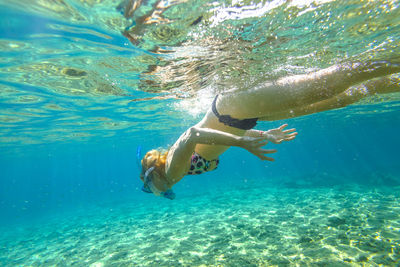 Woman swimming in sea