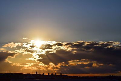 Sun shining through clouds