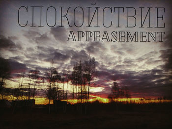 Information sign on field against sky during sunset