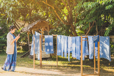 Side view of clothes drying against plants