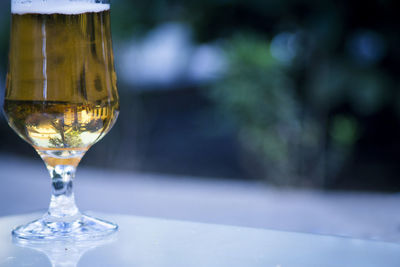 Close-up of wine glass on table