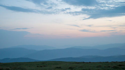 Scenic view of landscape against sky during sunset