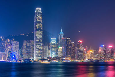 Illuminated city at waterfront