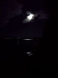 Silhouette of sea against sky at night