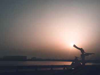 Scenic view of sea against clear sky during sunset