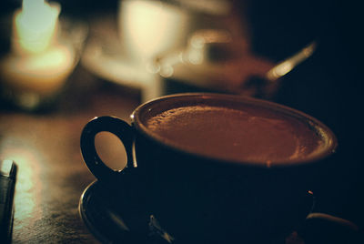 Close-up of coffee cup on table