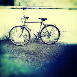 Bicycle parked by sea
