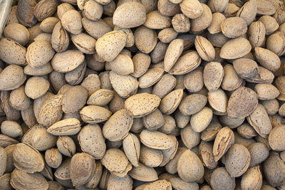 Full frame shot of roasted shelled almonds for sale