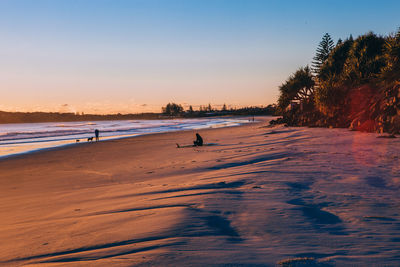 View of beach at sunset