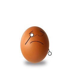 Close-up of broken egg against white background