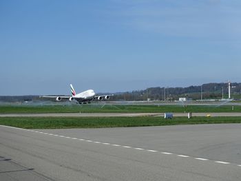 View of landscape against blue sky