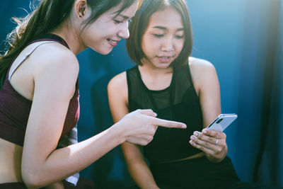 Young woman using mobile phone