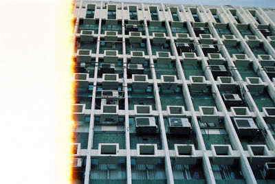 Low angle view of modern building in city against sky