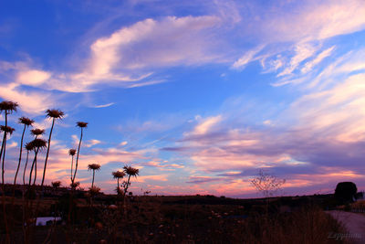 Scenic view of silhouette landscape against sky during sunset