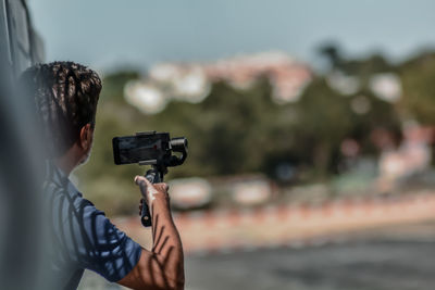 Man photographing with camera