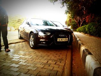 Close-up of car on road