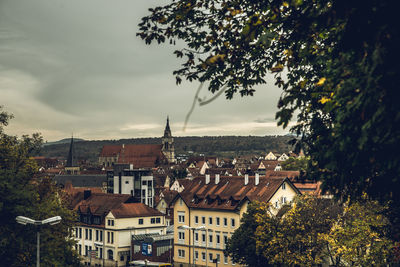 Buildings in town against sky