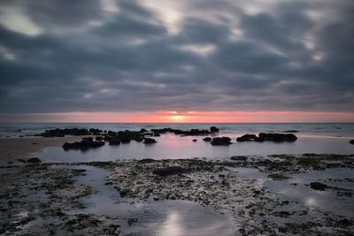 Scenic view of sea against sky at sunset