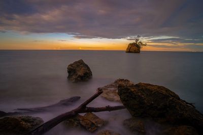 Scenic view of sea against sky during sunset